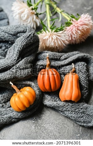 Candles in the shape of the pumpkin. Place for text. Cozy autumn concept 