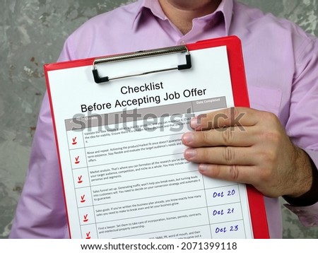 Business concept meaning Checklist Before Accepting Job Offer with sign on the sheet.
