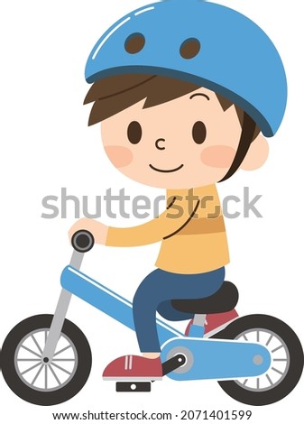Boy riding a bicycle happily