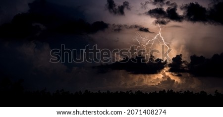 A flash of lightning in a dark sky