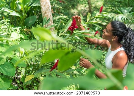 Woman Exploring Tropical Forest. Vacation and tourism concept