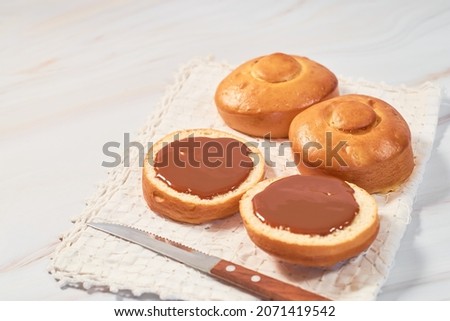 Mexican bisquet or biscuit bread, halved with caramel.