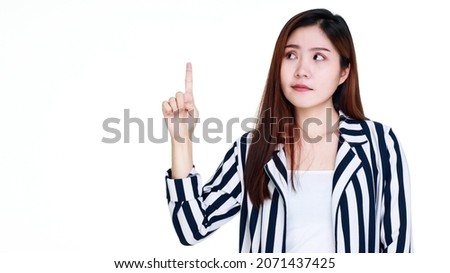 beautiful young healthy girl with black and white stripe suit on attractive cutout portrait standing with sadly doubt and finger up pointing out one unsatisfied wrong choice