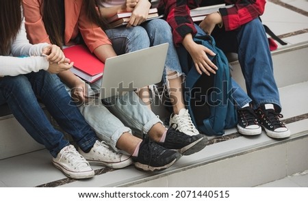 Group of four young attractive asian girls college students studying together in university campus outdoor. Concept for education, friendship and college students life. Royalty-Free Stock Photo #2071440515