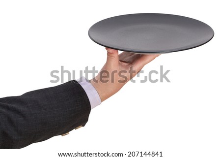 above view of hand with empty flat black plate isolated on white background