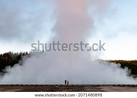This picture was taken just a few minutes before sunrise in Yellowstone National Park. I think the old couple staring at the steam perfectly embodies people that love to travel together. 