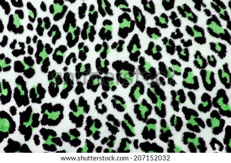 Green and black leopard pattern. Spotted fur animal print as background.