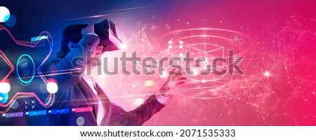 Metaverse Technology concept. Businessman use VR virtual reality goggle and experiences of metaverse virtual world for business future. Visualization, Virtual augmented reality on social network. Royalty-Free Stock Photo #2071535333