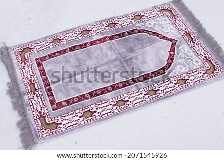 Sejadah isolated on white or 
High resolution Praying mat rug or Sejadah used by Muslims if they need