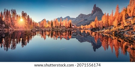 Panoramic autumn view of popular tourist destination - Federa lake among red larch trees. Spectacular sunrise in Dolomite Alps. Colorful morning scene of Italy. Beauty of nature concept background.
 Royalty-Free Stock Photo #2071556174