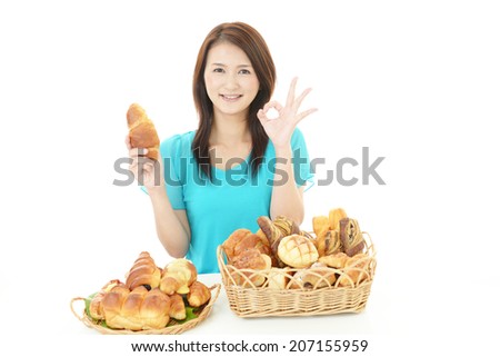 Smiling woman with bread