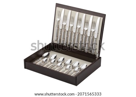 Set of silver cutlery in the box on an isolated white background. Gift wrapped forks, knives and spoons Royalty-Free Stock Photo #2071565333