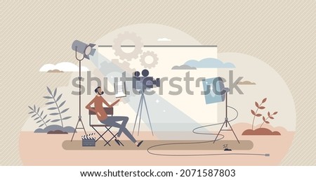 Producer and film director for cinematography project tiny person concept. Artistic occupation with TV show and movies shooting for motion picture scenes vector illustration. Media studio with cameras Royalty-Free Stock Photo #2071587803