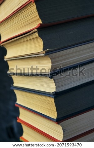 Stack of battered old books.Retro library and books