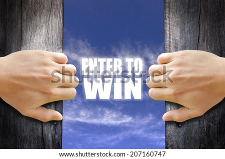 "Enter to Win" text in the sky behind 2 hands opening the wooden door.