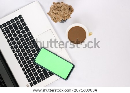 work desk with a cup of coffee isolated on white background