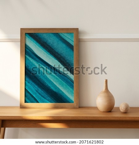 Ombre blue ocean picture frame on wooden sideboard table