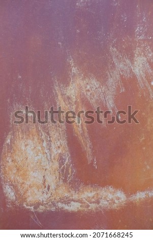 Beautiful rusty orange metal texture background. Creative, abstract backdrop with scratches and stains. Old worn iron garage door detail. Rough, rustic and grunge. Vertical, close up, copy space