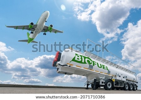 Airplane and biofuel tank. Decarbonization concept Royalty-Free Stock Photo #2071710386