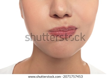 Woman rinsing her mouth on white background, closeup. Dental care Royalty-Free Stock Photo #2071757453