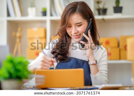 Small business, start-up business owners using computers at work, freelancers, saleswomen, checking production orders. Pack SME products for delivery to customers sell ecommerce delivery ideas