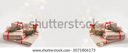 Christmas and New Year composition. Fir tree branches, red decorations, Handmade gifts on white background with golden bokeh. Winter, holiday concept. Flat lay, side view Royalty-Free Stock Photo #2071806173