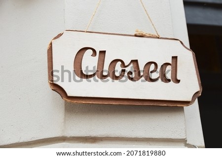 Closed sign hanging front of cafe during covid-19 pandemic
