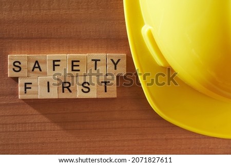 Work safety first word written on wood block. work safety text on table, concept 