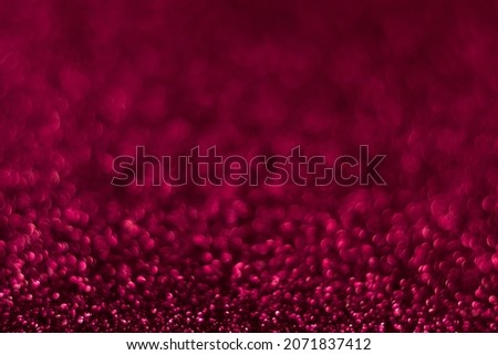 Pink sparkling glitter bokeh background, abstract defocused texture. Holiday lights