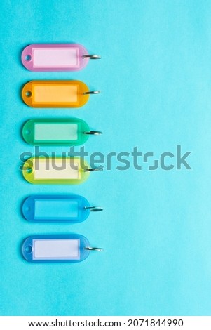 Colorful key-rings with copy space on blue background