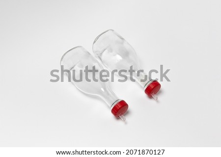 Glass oil dispenser bottles with pourer isolated on white background.High-resolution photo.