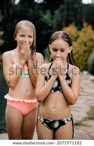 So-called Coast Pastries LITTLE GIRLS POSING IN SWIMSUITS Stock Photos and Images - Avopix.com