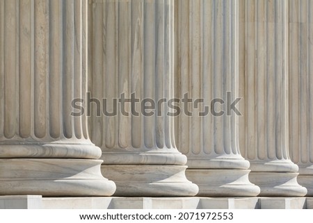 Architectural detail of marble ionic order columns Royalty-Free Stock Photo #2071972553