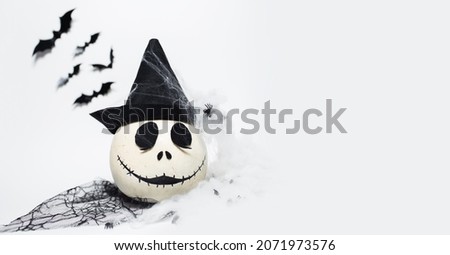 Happy Halloween, white pumpkin wearing hat on white background. Panoramic view.