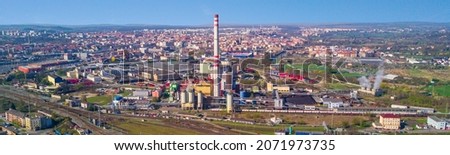 Aerial view of heating plant and thermal power plant near railway station. Combined modern power plant for heating and electrical power production. Industrial zone from above. Pilsen, European union. Royalty-Free Stock Photo #2071973735