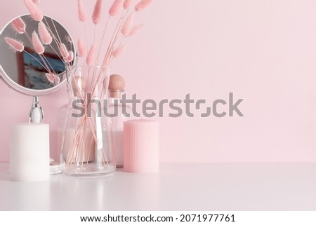 Cosmetic table with mirror, candles, dried flowers. Bathroom accessories. Home decor. Royalty-Free Stock Photo #2071977761
