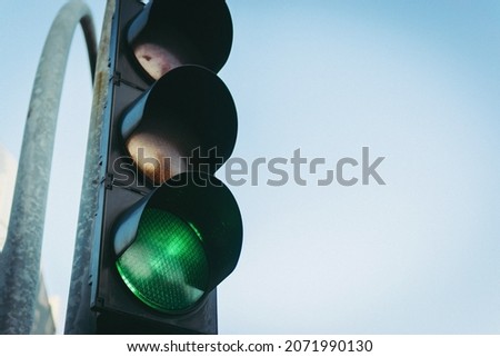 A traffic light showing a green light