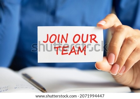 we are hiring written on a paper card in woman hand