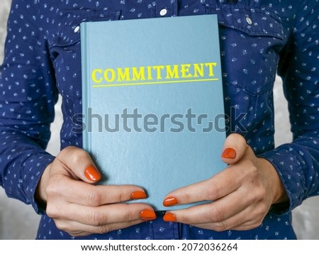 Conceptual photo about COMMITMENT with written phrase. 
