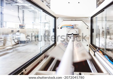 Warehouse of polypropylene pipes. Workshop with extruders for producing plastic pipes. High speed extrusion line of water suppply and gas pipe. Manufacturing facility. Royalty-Free Stock Photo #2072045780