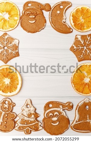 Christmas gingerbread with orange slices. New Year's card.