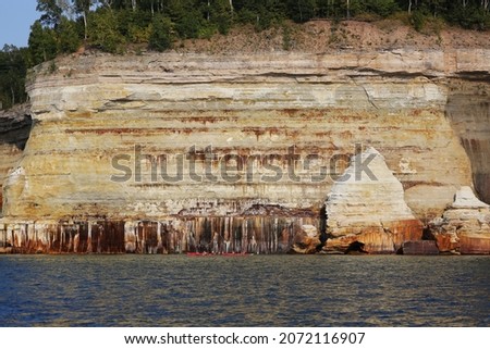 Colorful sandstone cliffs and formations at Pictured Rocks National Lakeshore of Lake Superior, Munising, Michigan, USA