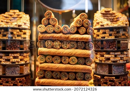 Tasty Oriental sweets baklava. traditional oriental sweets baklava with nuts. traditional oriental sweets baklava with nuts. Juicy sweetness, Honey baklava. Pieces of sweet puff pastry. Soft focus. Royalty-Free Stock Photo #2072124326
