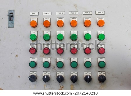 Control buttons on the control panel of machines in the factory