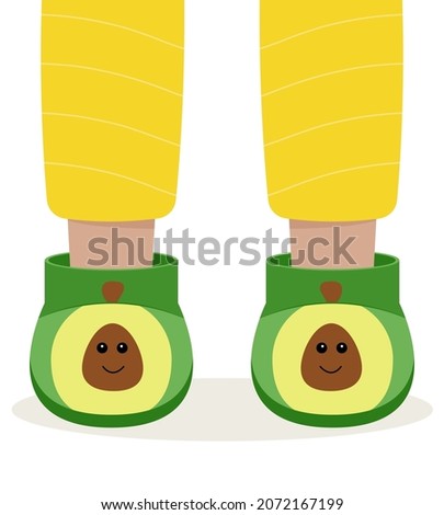 Children pajama slippers. Children feet in funny slippers. Pajama party.