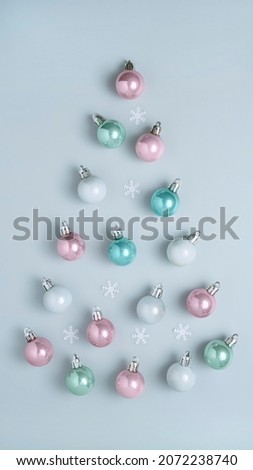 Christmas balls in pastel colors, top view, Christmas composition, vertical format for stories