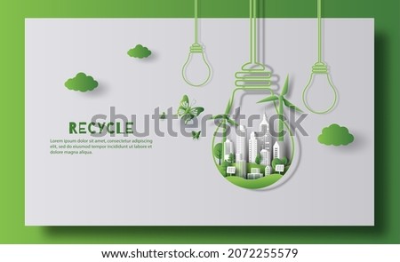 Design for an eco friendly and recycle banner, a light bulb shape with city and garden, save the planet and energy concept, paper illustration, and 3d paper. Royalty-Free Stock Photo #2072255579