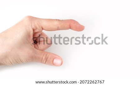 part of left hand showing downwards direction, index finger with a extensor tendon injury pointing way, mallet finger tip bending down, deformity in the last phalangeal bone, poster Royalty-Free Stock Photo #2072262767