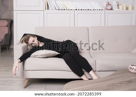 Lifeless beautiful woman in a room. Simulation of the crime scene.



