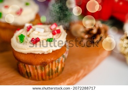 Cupcakes decorated with sprinkles in the form of a Christmas tree. Festive sweet treats, Christmas dessert